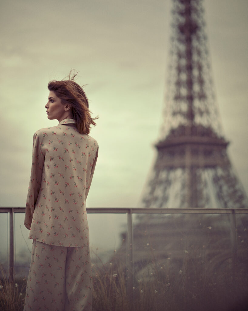 model wearing Louis Vuitton pyjama in front of the Eiffel Tower in Paris